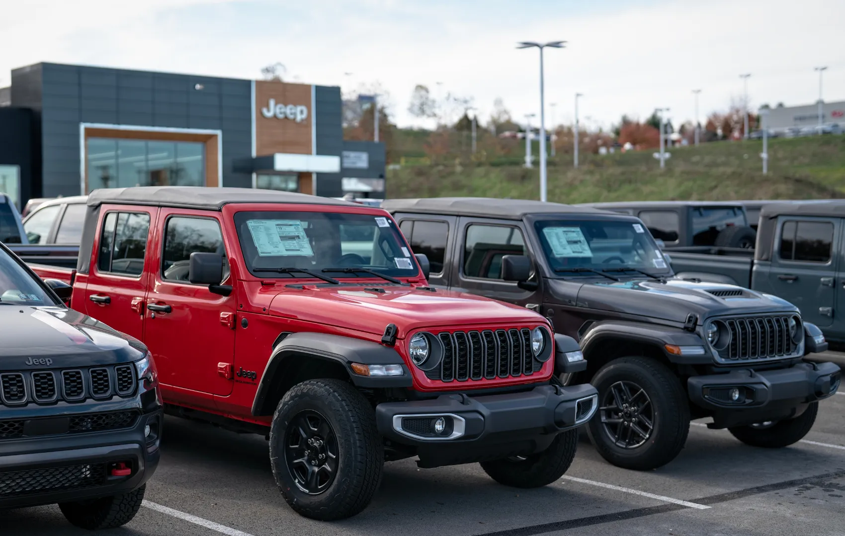 New Jeep Gladiators lined up next to each other at C. Harper CDJR Mon Valley